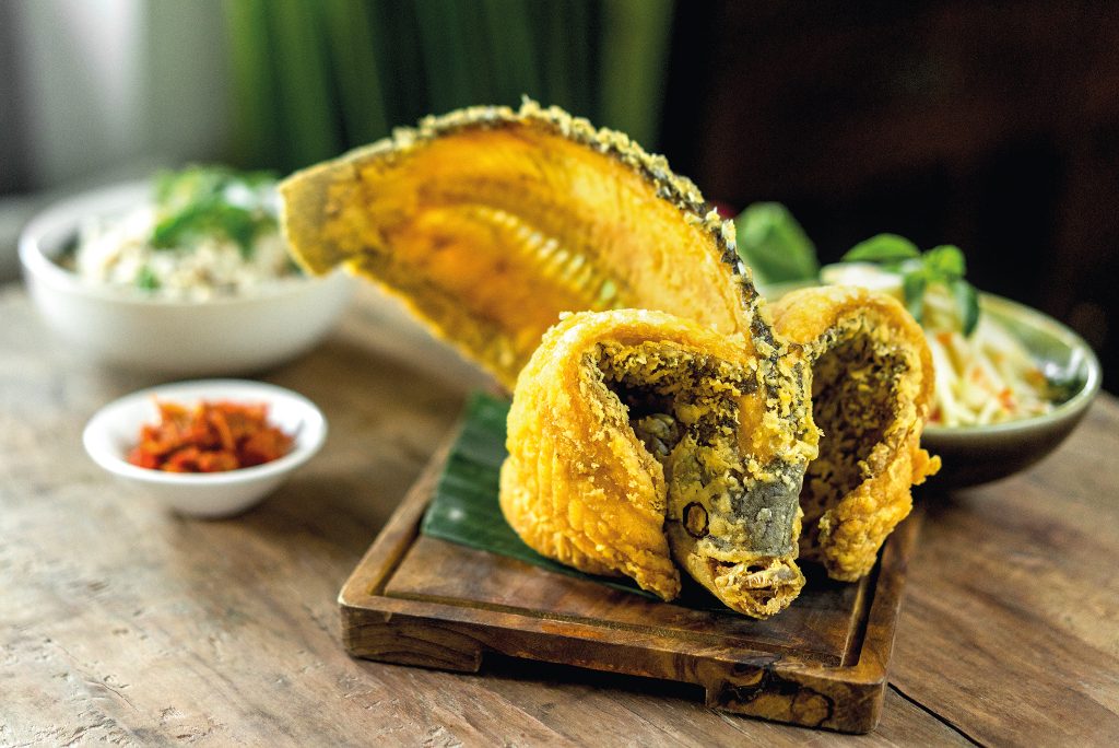 Crispy whole fish with sambal mangga and kemangi