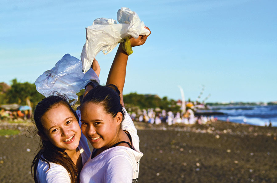 Mel Bel Holding Plasic Bags at Beach