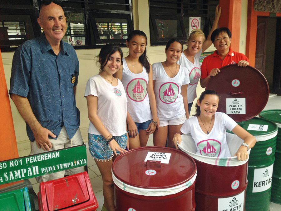 Kids in Action With Trash Bins