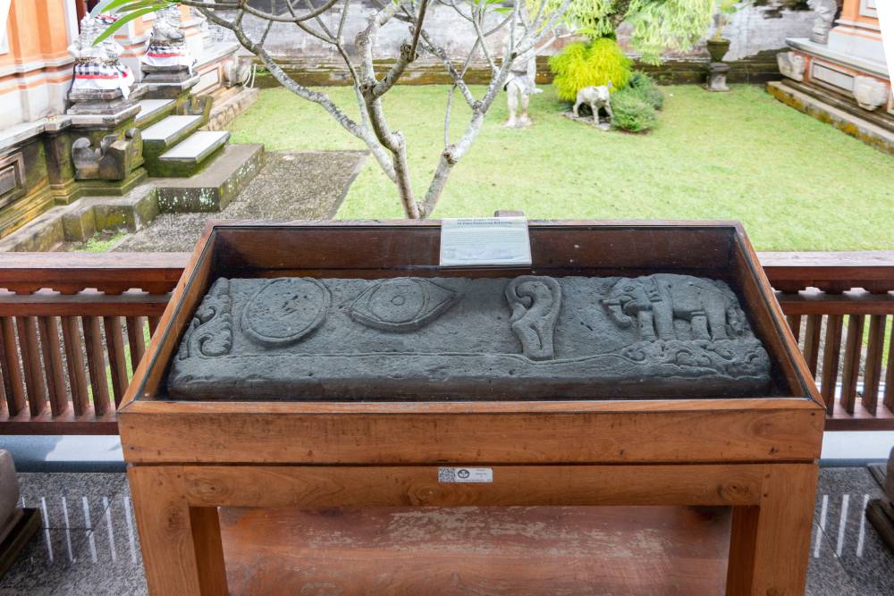 the carvings of a moon, eye, ear and elephant at Museum Gedong Arca