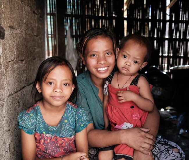 charities-in-bali-East-Bali-Poverty-2--Happy-young-Mum-after-her-baby-is-free-from-malnutrition