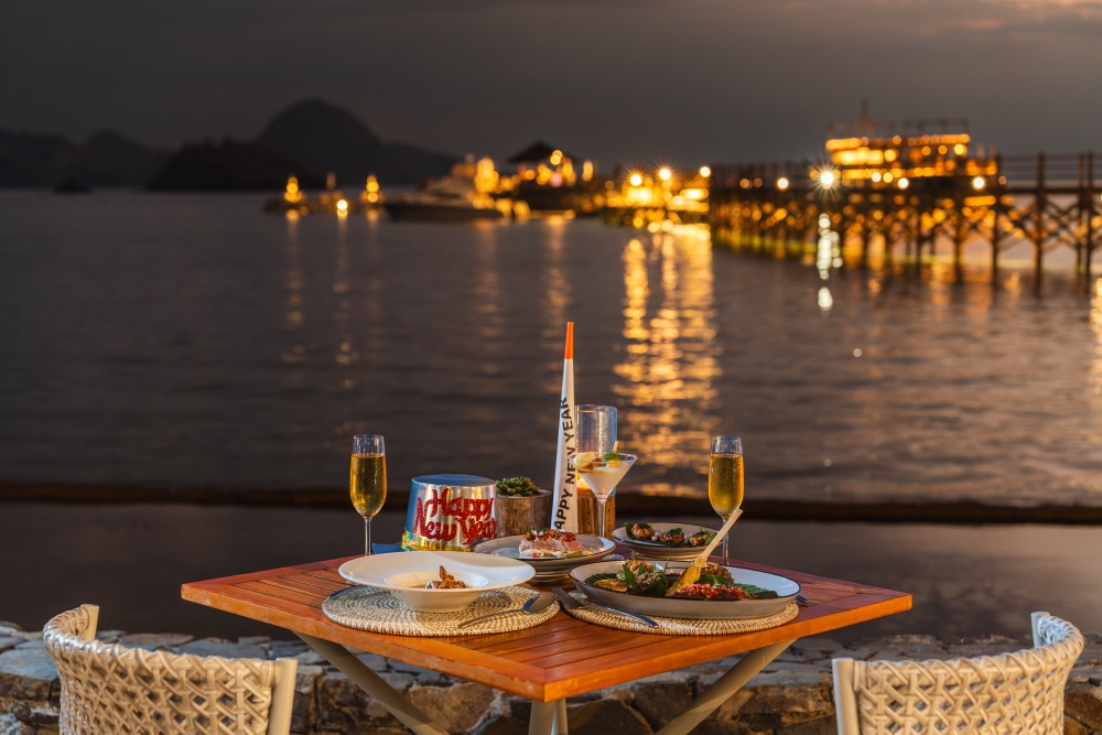 Festive dinner by the beach at AYANA Komodo Waecicu Beach